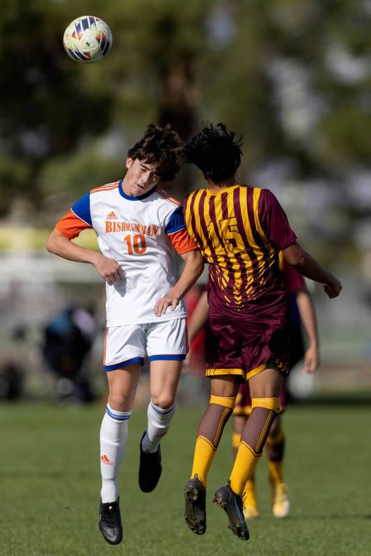 Bishop Gorman’s Luke Parker (10) heads the ball against Eldorado’s Ivan Martinez ...