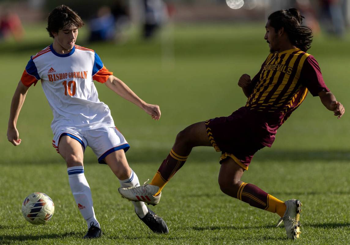 Bishop Gorman’s Luke Parker (10) steals possession from Eldorado’s Esteban Paz du ...
