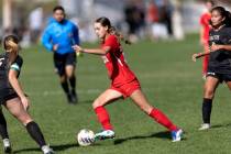 Coronado’s Trinity Buchanan (18) dribbles between Faith Lutheran’s Taylor Folk, l ...