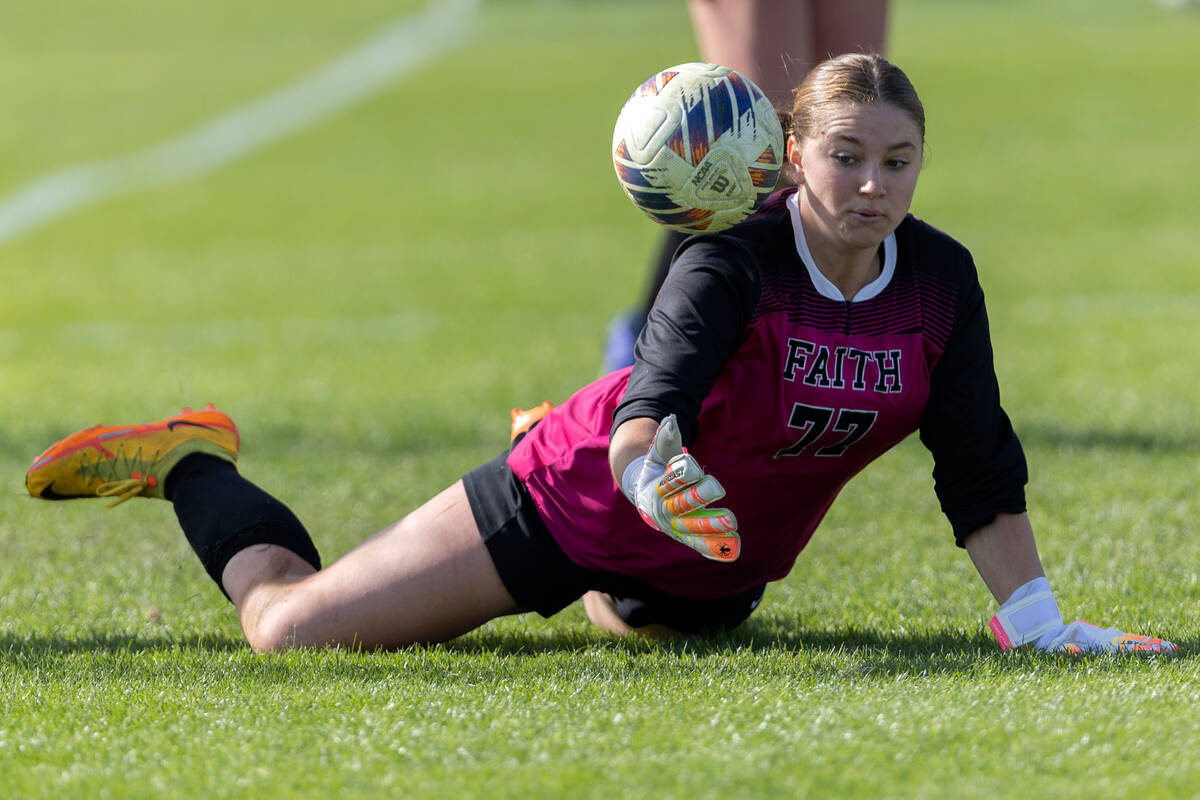 Faith Lutheran’s Elke Travis loses control of the ball while making a save during the Cl ...