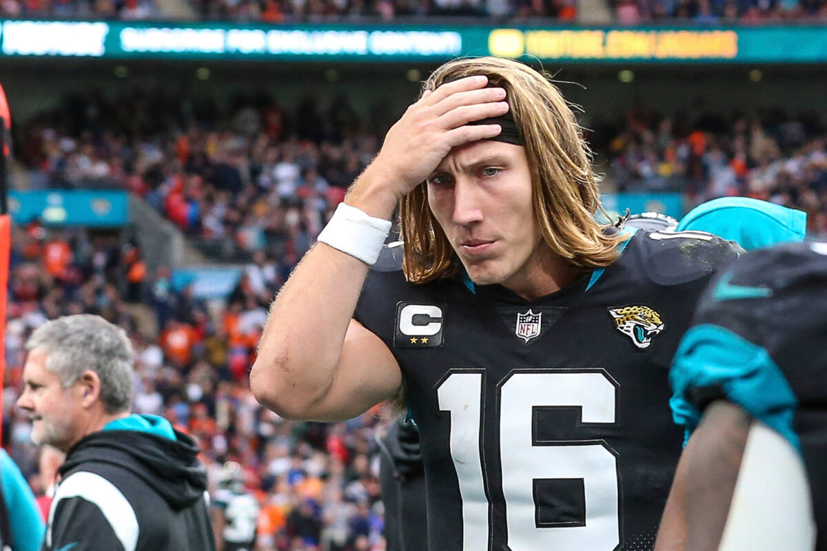 Jacksonville Jaguars quarterback Trevor Lawrence (16) walks the sideline during an NFL football ...