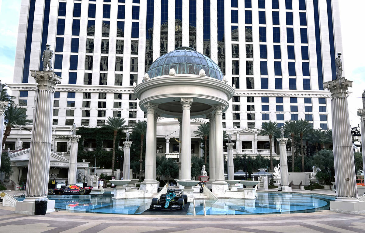 Formula One Las Vegas Grand Prix cars are set up for a VIP event in the evening about the pool ...