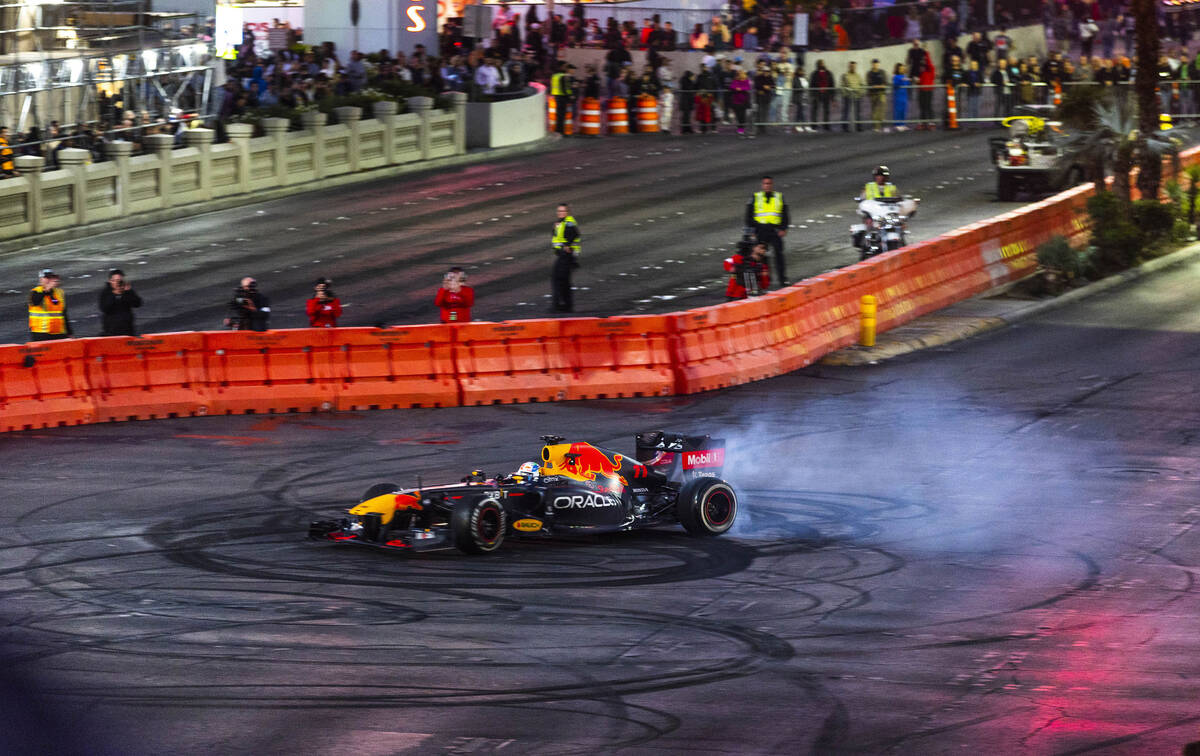 Racer Sergio Pérez turns doughnuts across from the Bellagio while racing up the Strip duri ...