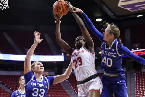UNLV Lady Rebels center Desi-Rae Young (23) grabs a rebound between Air Force Falcons forward N ...
