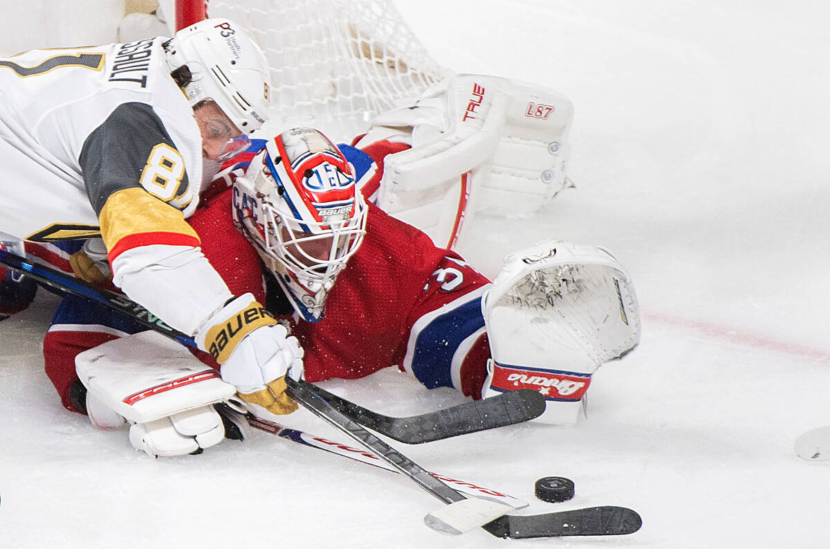 Montreal Canadiens goaltender Jake Allen stops Vegas Golden Knights' Jonathan Marchessault duri ...