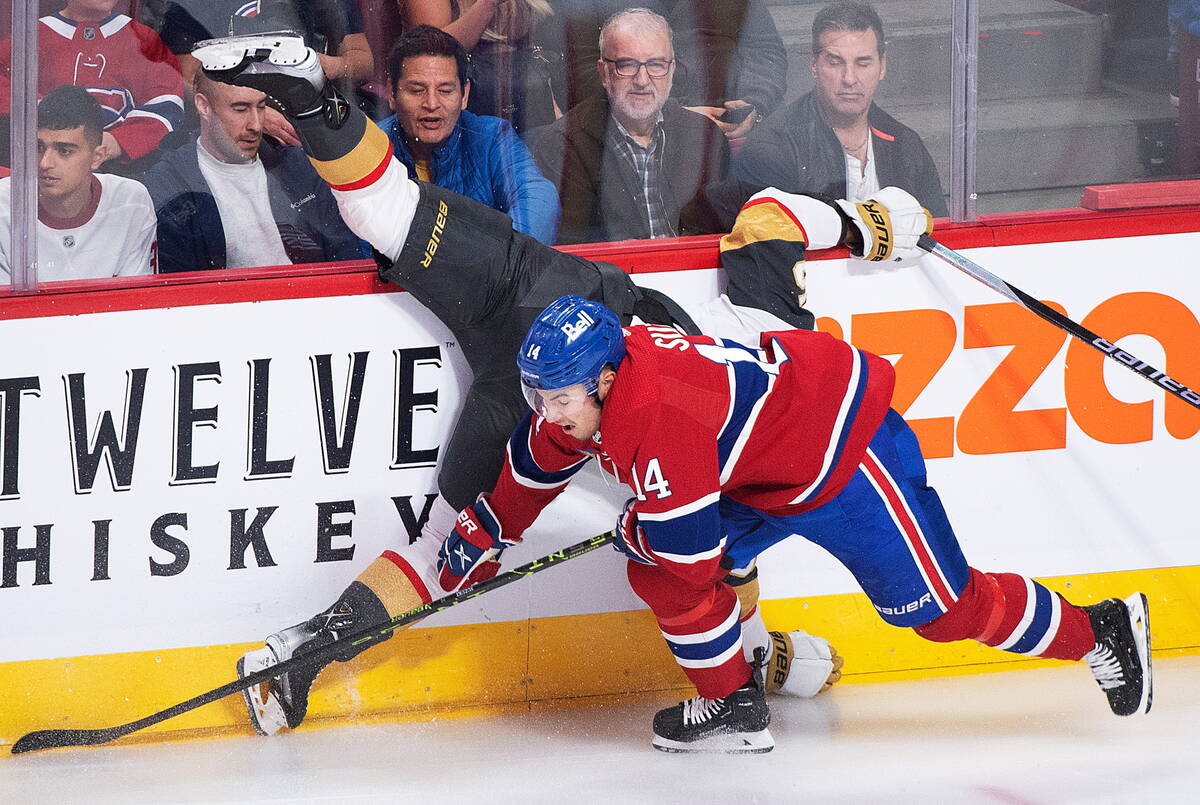 Montreal Canadiens' Nick Suzuki (14) collides with Vegas Golden Knights' Keegan Kolesar during ...