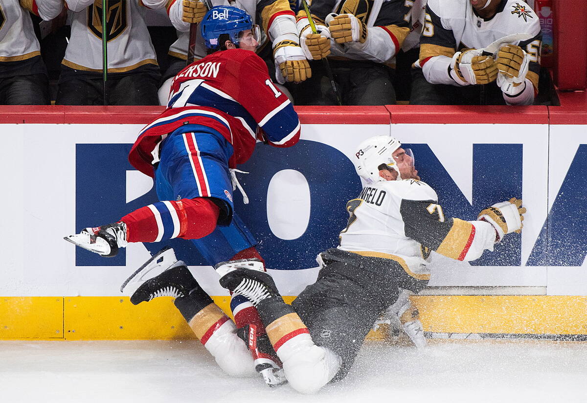 Montreal Canadiens' Josh Anderson, left, checks Vegas Golden Knights' Alex Pietrangelo into the ...