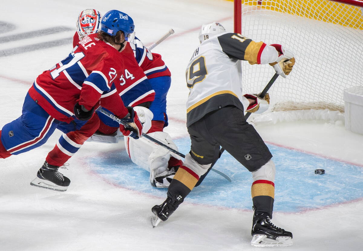 Vegas Golden Knights' Reilly Smith (19) scores against Montreal Canadiens goaltender Jake Allen ...