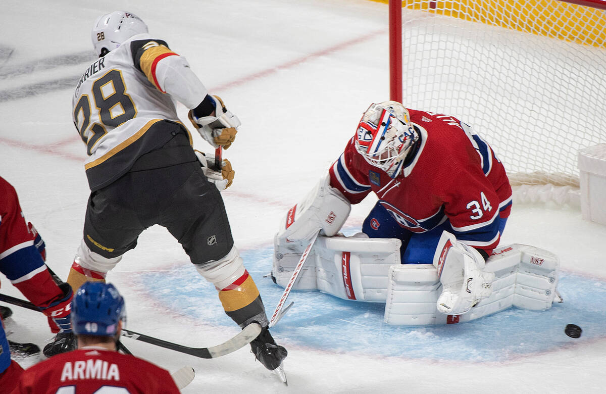 Montreal Canadiens goaltender Jake Allen stops Vegas Golden Knights' William Carrier (28) durin ...