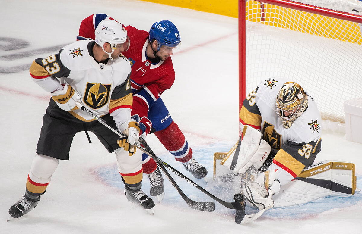 Montreal Canadiens' Sean Monahan (91) moves in on Vegas Golden Knights goaltender Adin Hill as ...