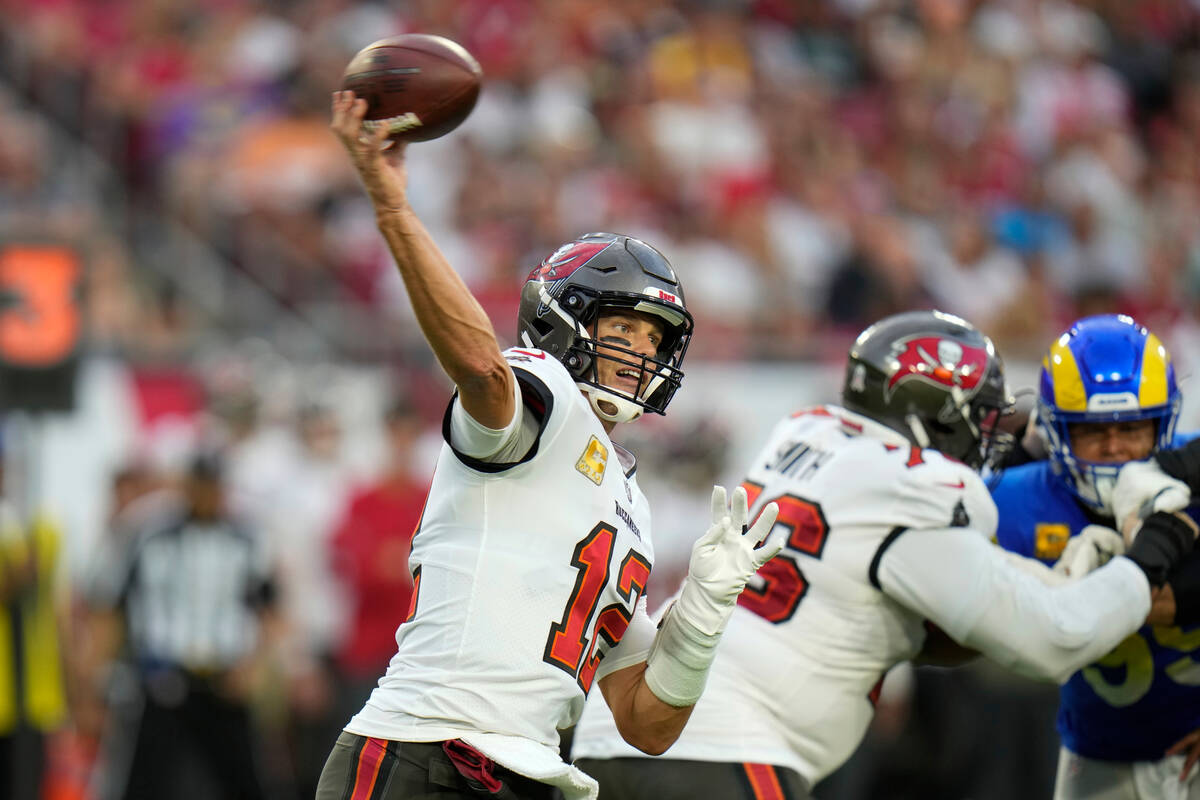 Tampa Bay Buccaneers quarterback Tom Brady (12) passes during the first half of an NFL football ...