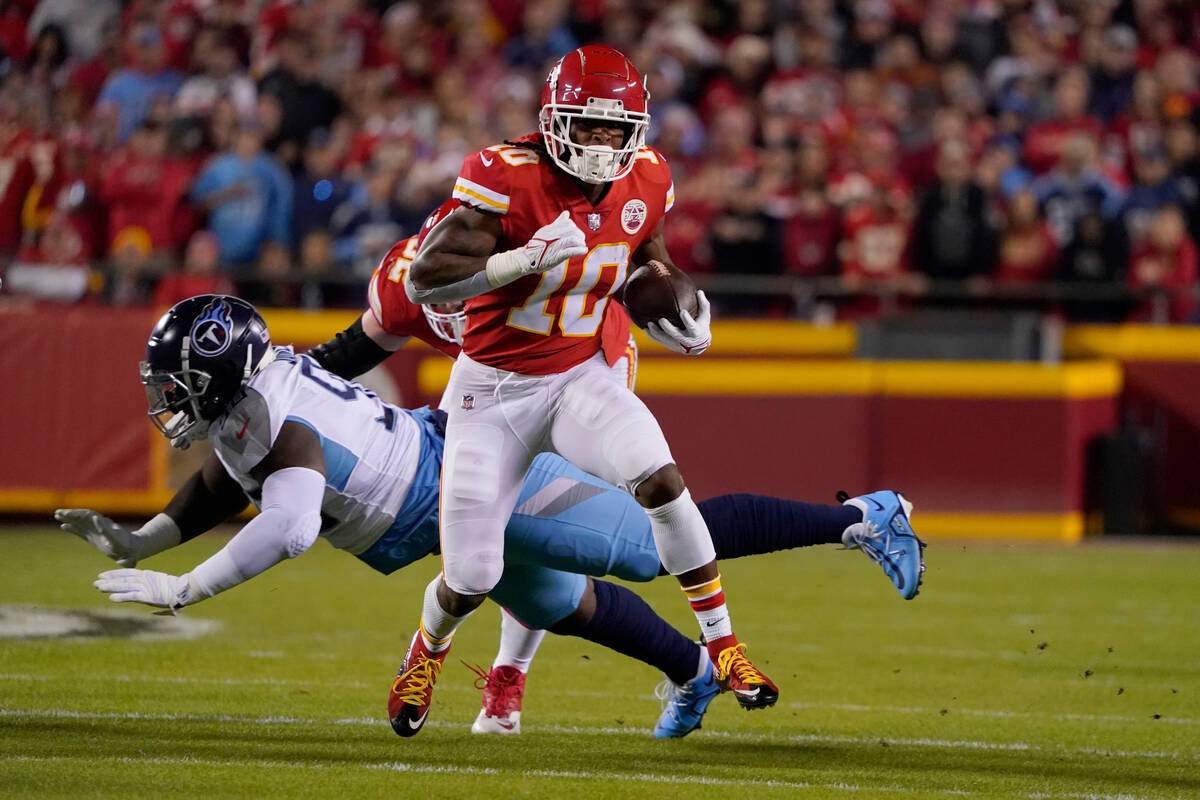 Kansas City Chiefs running back Isiah Pacheco (10) runs with the ball during the first half of ...