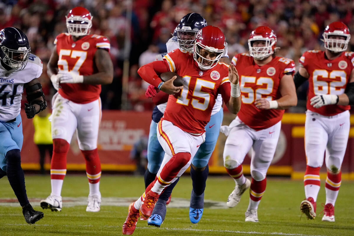 Kansas City Chiefs quarterback Patrick Mahomes runs with the ball during the first half of an N ...