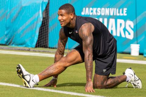 Raiders tight end Darren Waller stretches before an NFL game against the Jacksonville Jaguars a ...