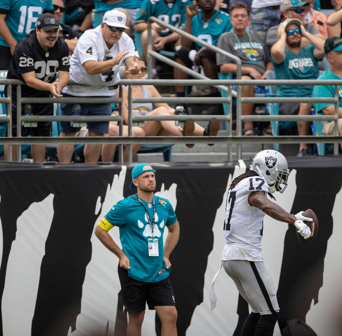 Raiders fans applaud as Raiders wide receiver Davante Adams (17) scores his second touchdown du ...