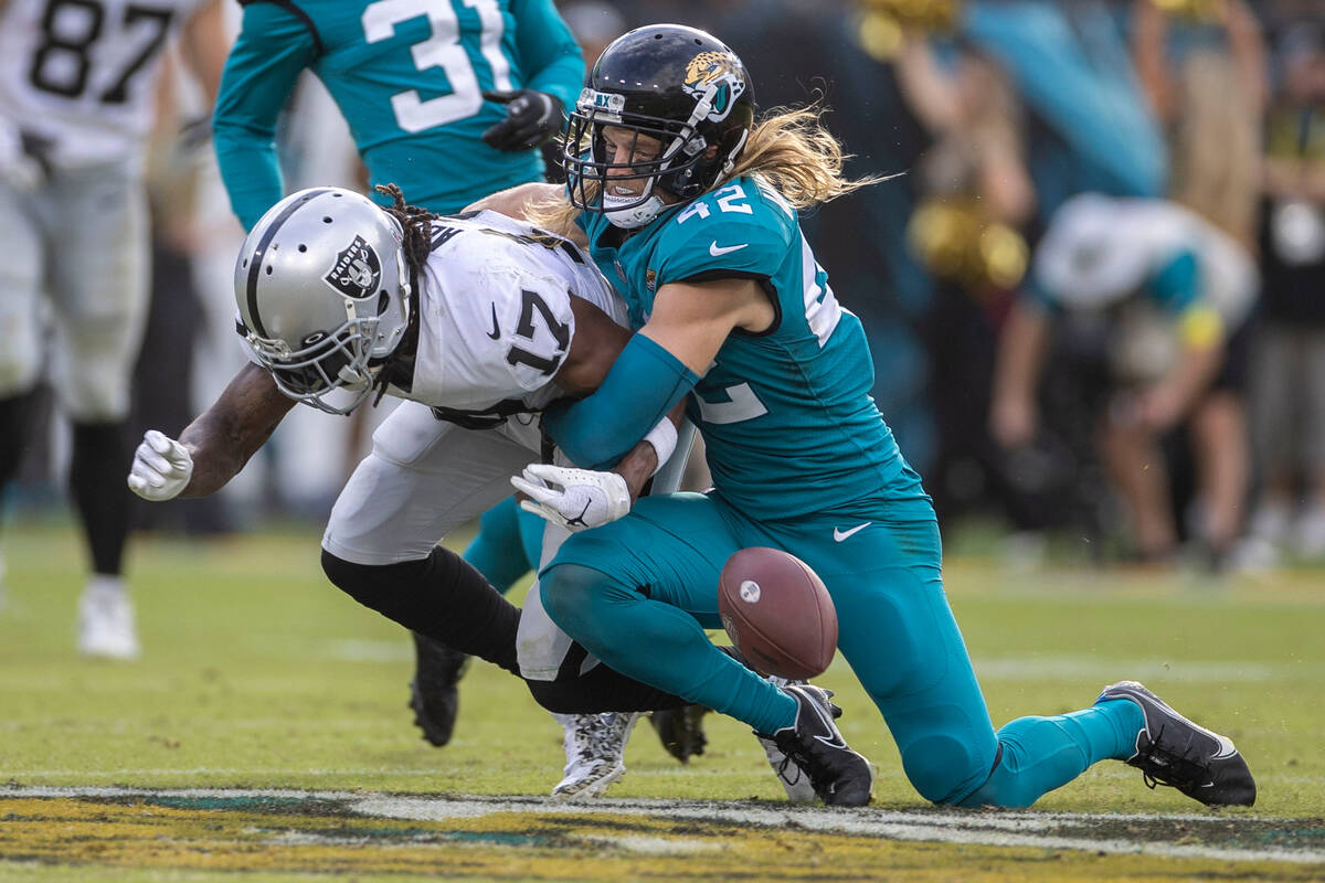 Jacksonville Jaguars safety Andrew Wingard (42) defends against Raiders wide receiver Davante A ...