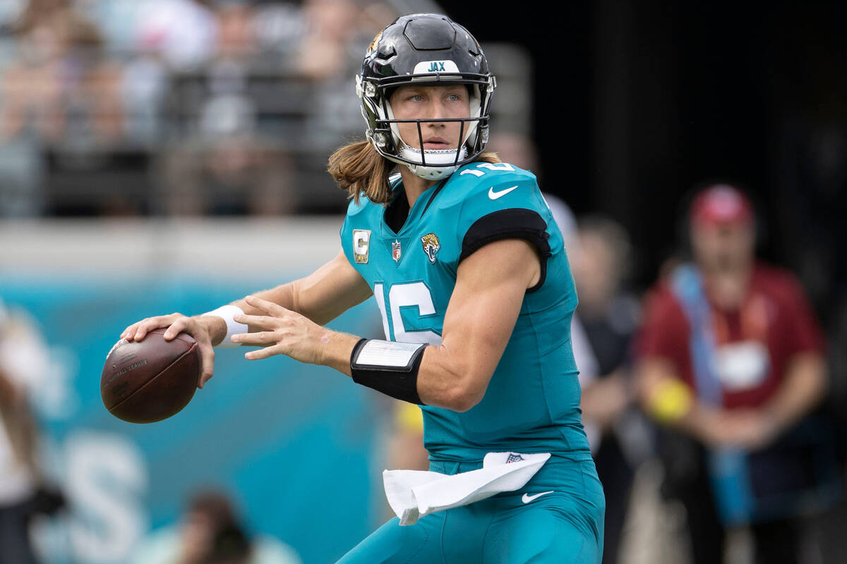 Jacksonville Jaguars quarterback Trevor Lawrence (16) prepares to throw against the Raiders dur ...