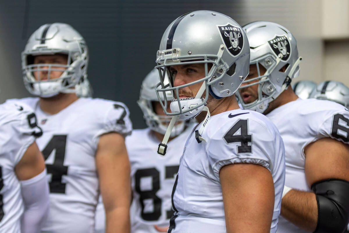 Raiders quarterback Derek Carr (4) waits in the tunnel to take the field before an NFL game aga ...