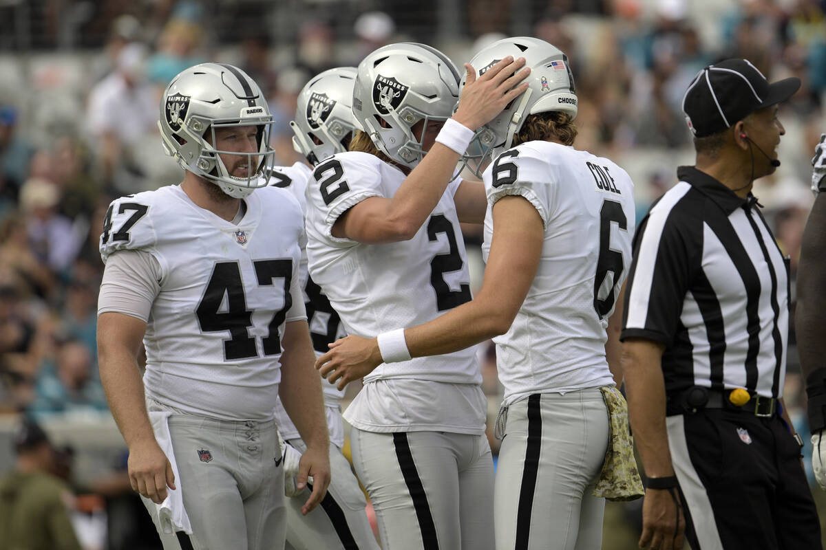 Las Vegas Raiders place kicker Daniel Carlson (2) is congratulated by holder AJ Cole (6) after ...