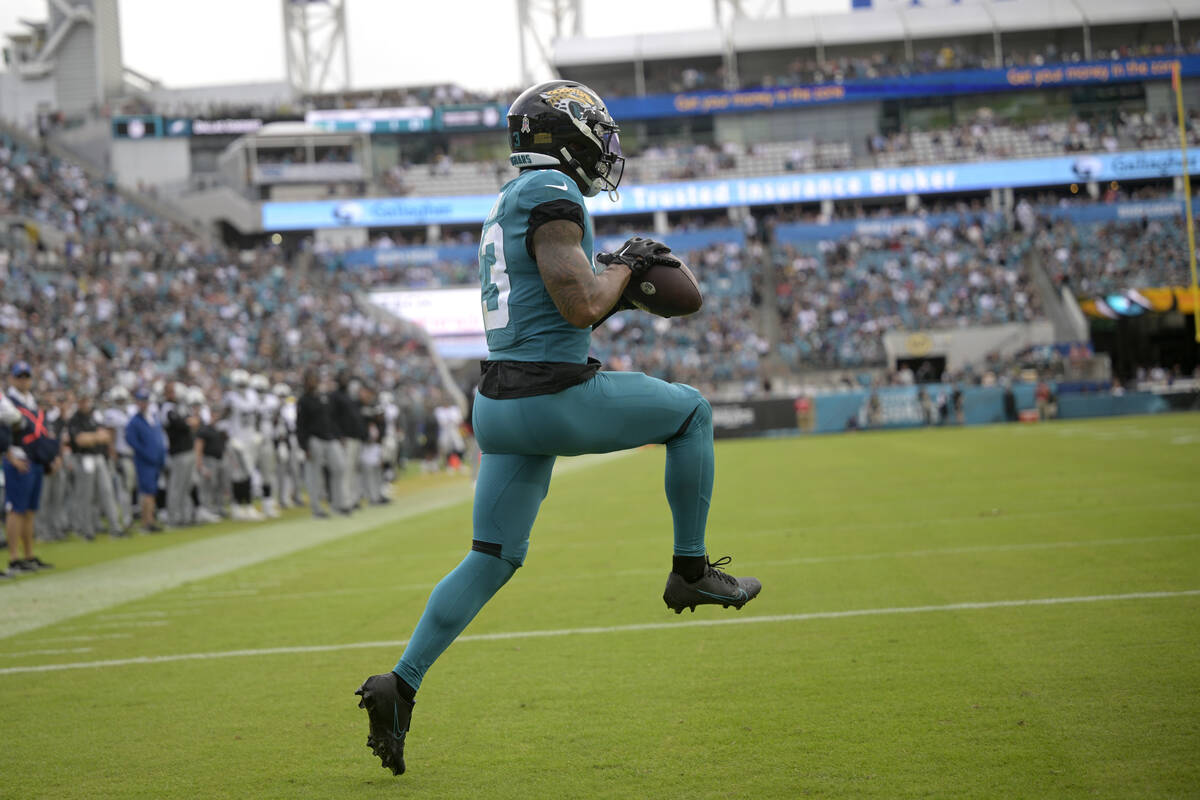 Jacksonville Jaguars wide receiver Christian Kirk catches a touchdown pass against the Las Vega ...