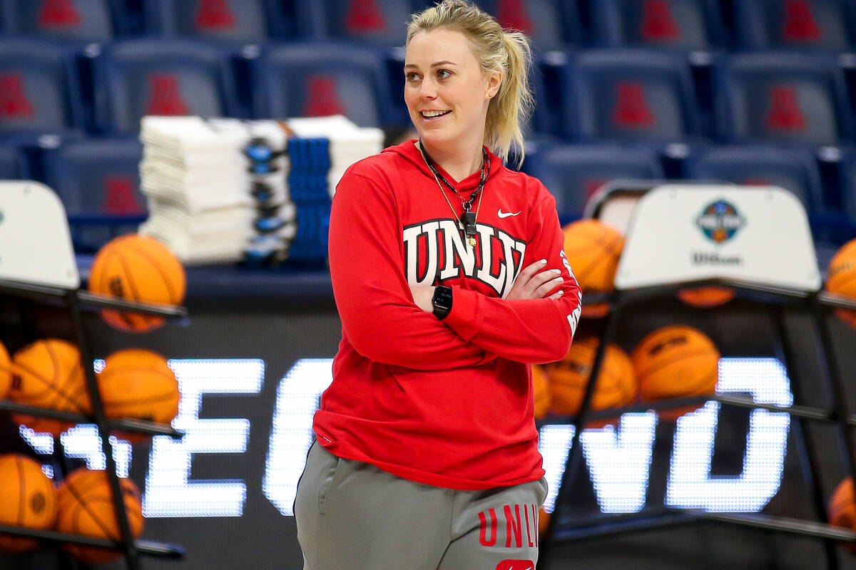 UNLV coach Lindy La Rocque smiles while watching the team shoot layups during practice for the ...