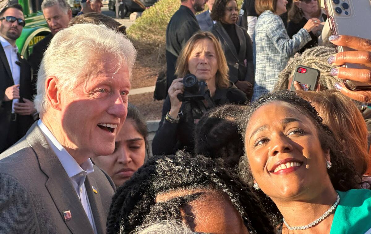 Andrea Dudley, 45, takes a photo with former President Bill Clinton in Henderson, Nevada, on No ...