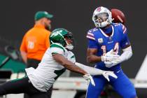 New York Jets cornerback D.J. Reed (4) breaks up a pass to Buffalo Bills wide receiver Stefon D ...