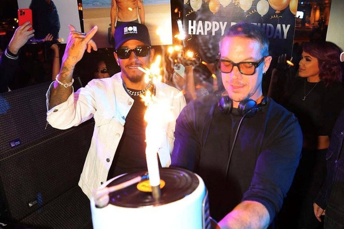 F1 superstar Lewis Hamilton, left, and DJ headliner Diplo celebrate Diplo's birthday and Hamilt ...