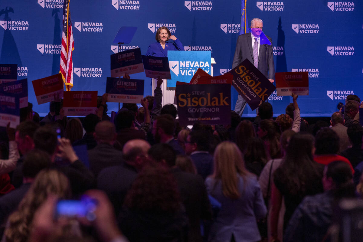 Senator Catherine Cortez Masto with Governor Steve Sisolak greet supporters before speaking dur ...