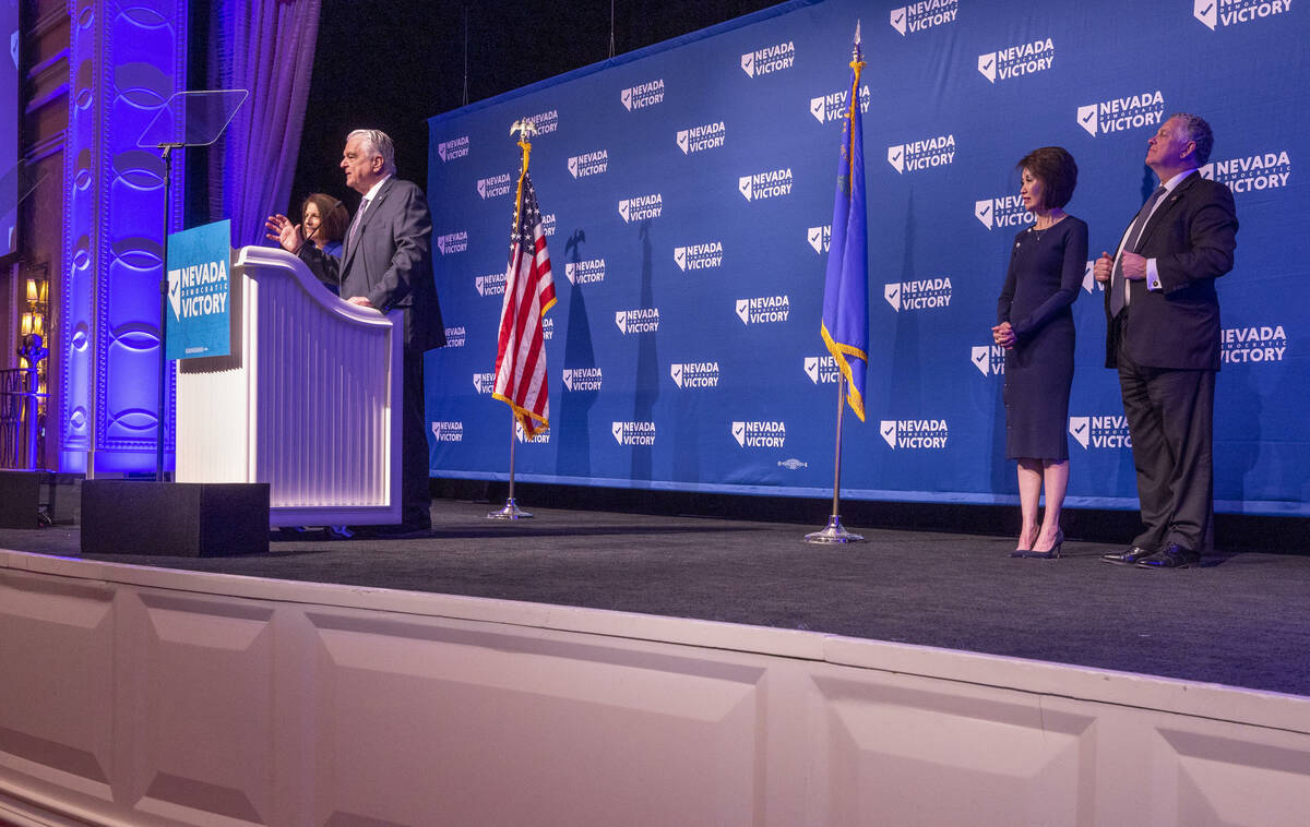 Senator Catherine Cortez Masto stands beside Governor Steve Sisolak while speaking as their spo ...