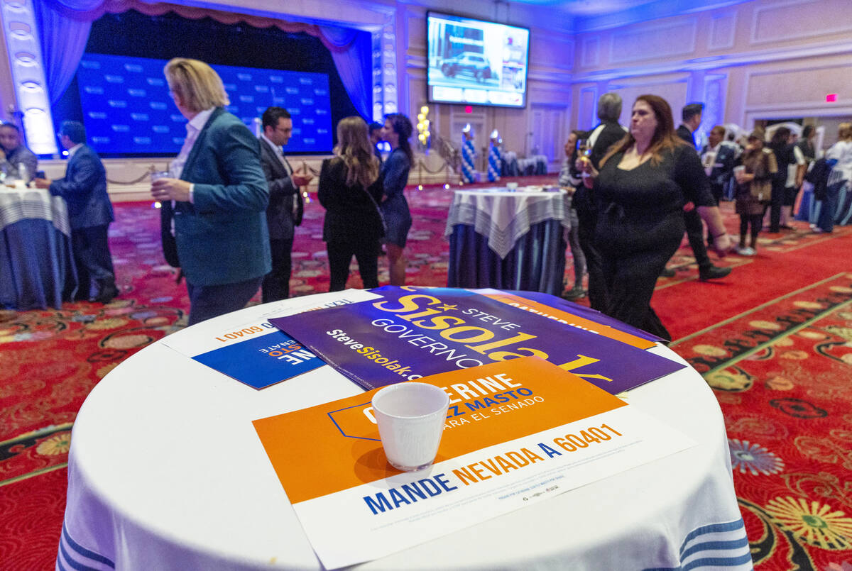 Supporters slowly depart as few stay to continue watching election results during the Nevada De ...