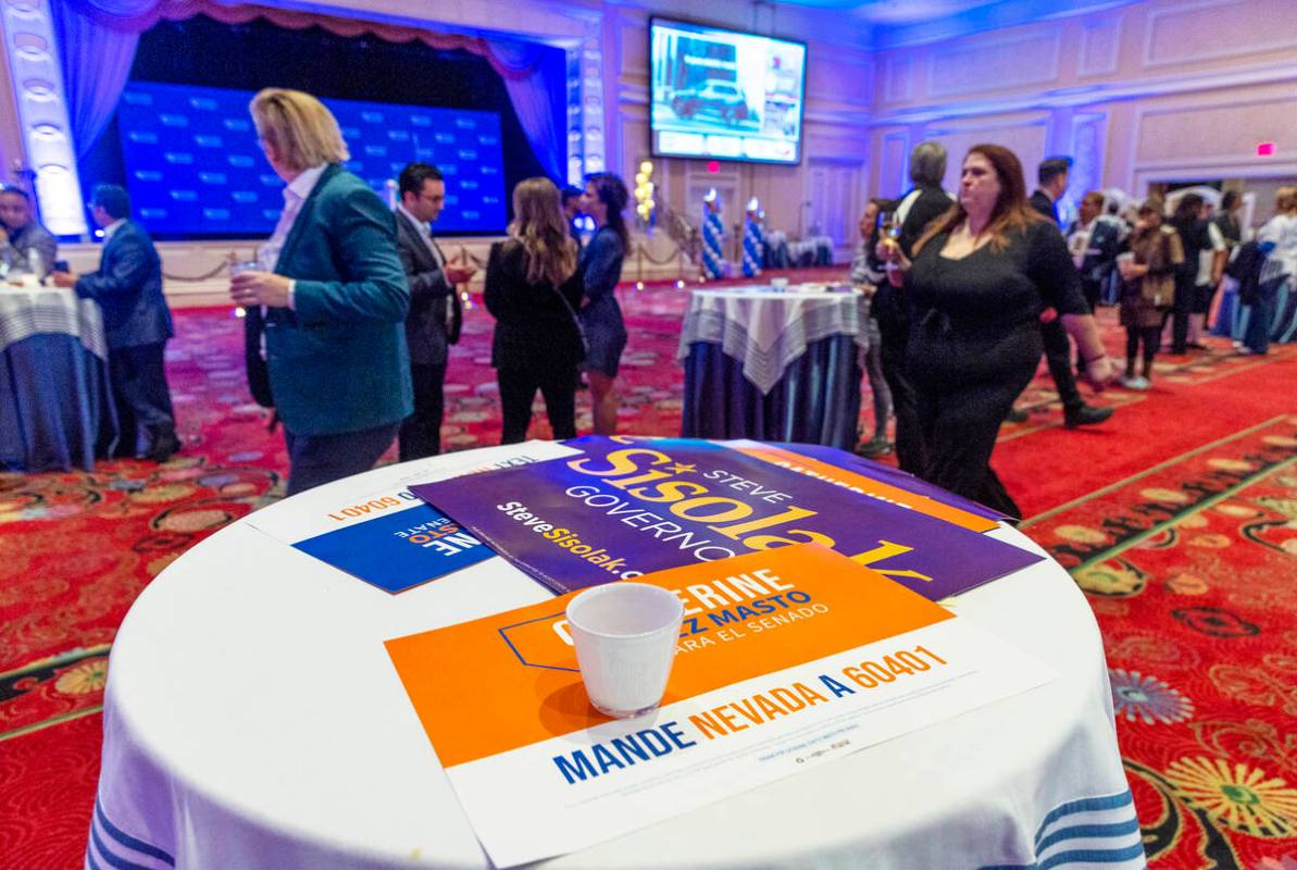 Supporters slowly depart as few stay to continue watching election results during the Nevada De ...