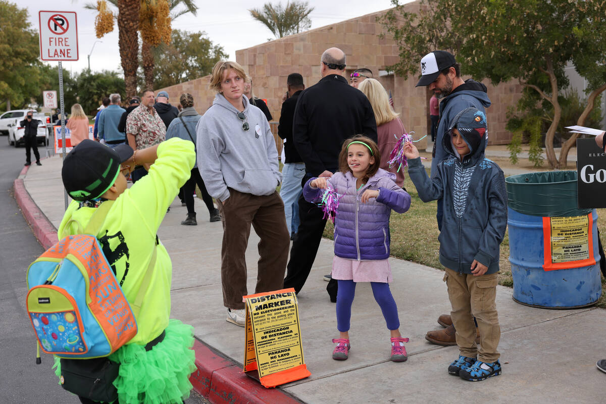 C.G. with Election Defenders nonpartisan poll monitoring group fires up people waiting in line, ...
