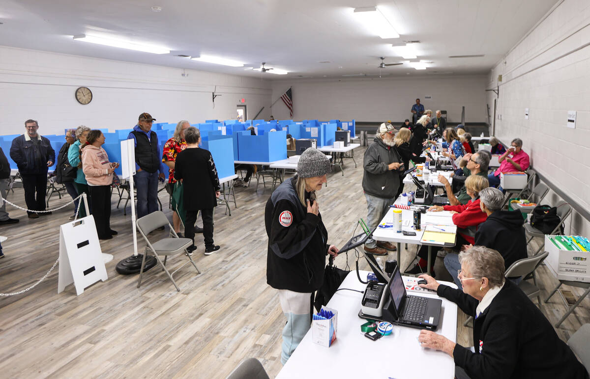 Nye County voters line up and check in with poll workers to cast their ballots on Election Day ...