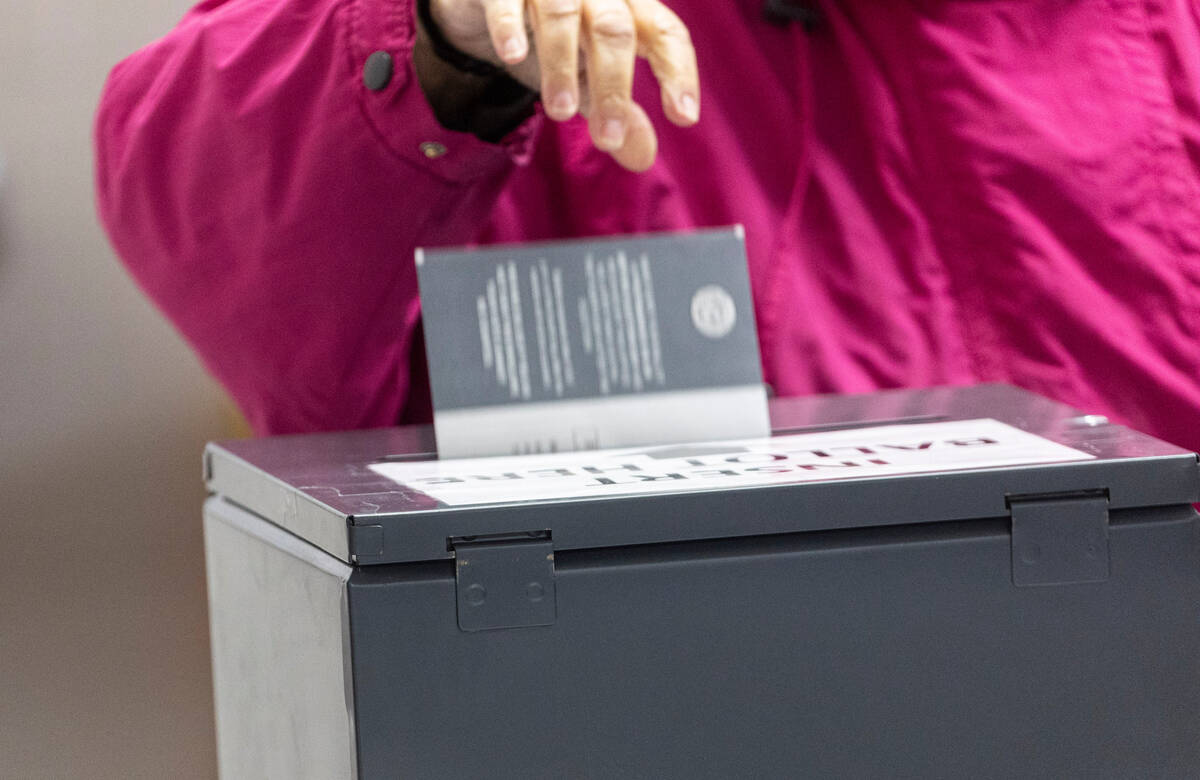 Nye County residents drop off mail-in ballots on Election Day at Bob Ruud Community Center in P ...
