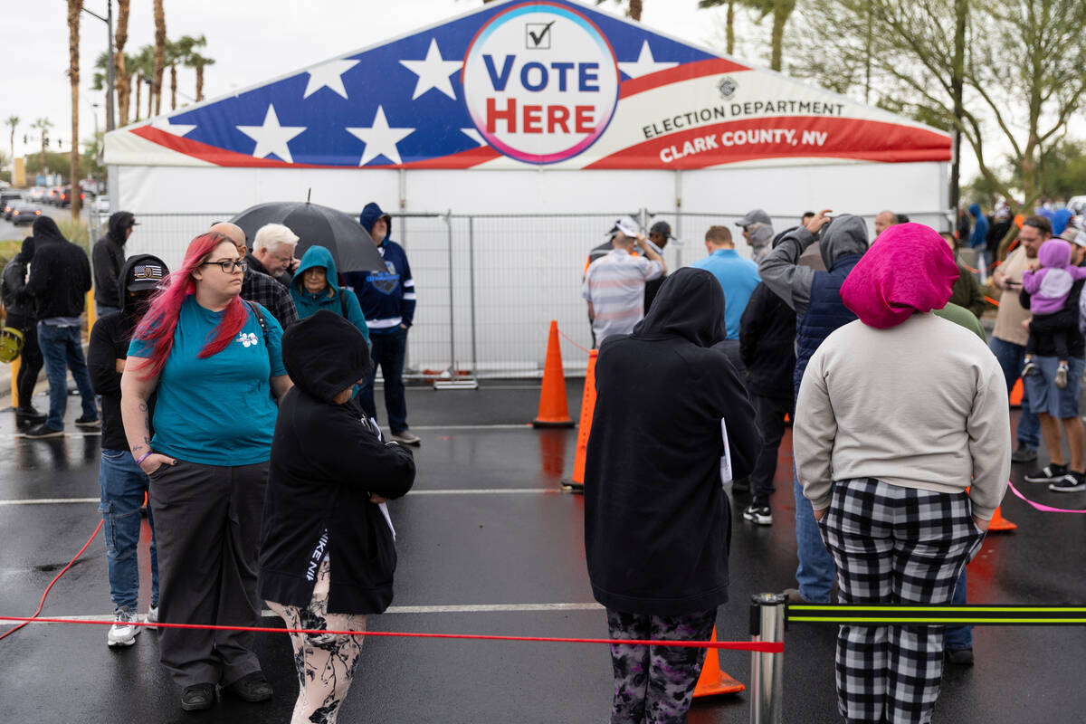 People wait in line to cast their vote at the Centennial Center polling place in Las Vegas, Tue ...