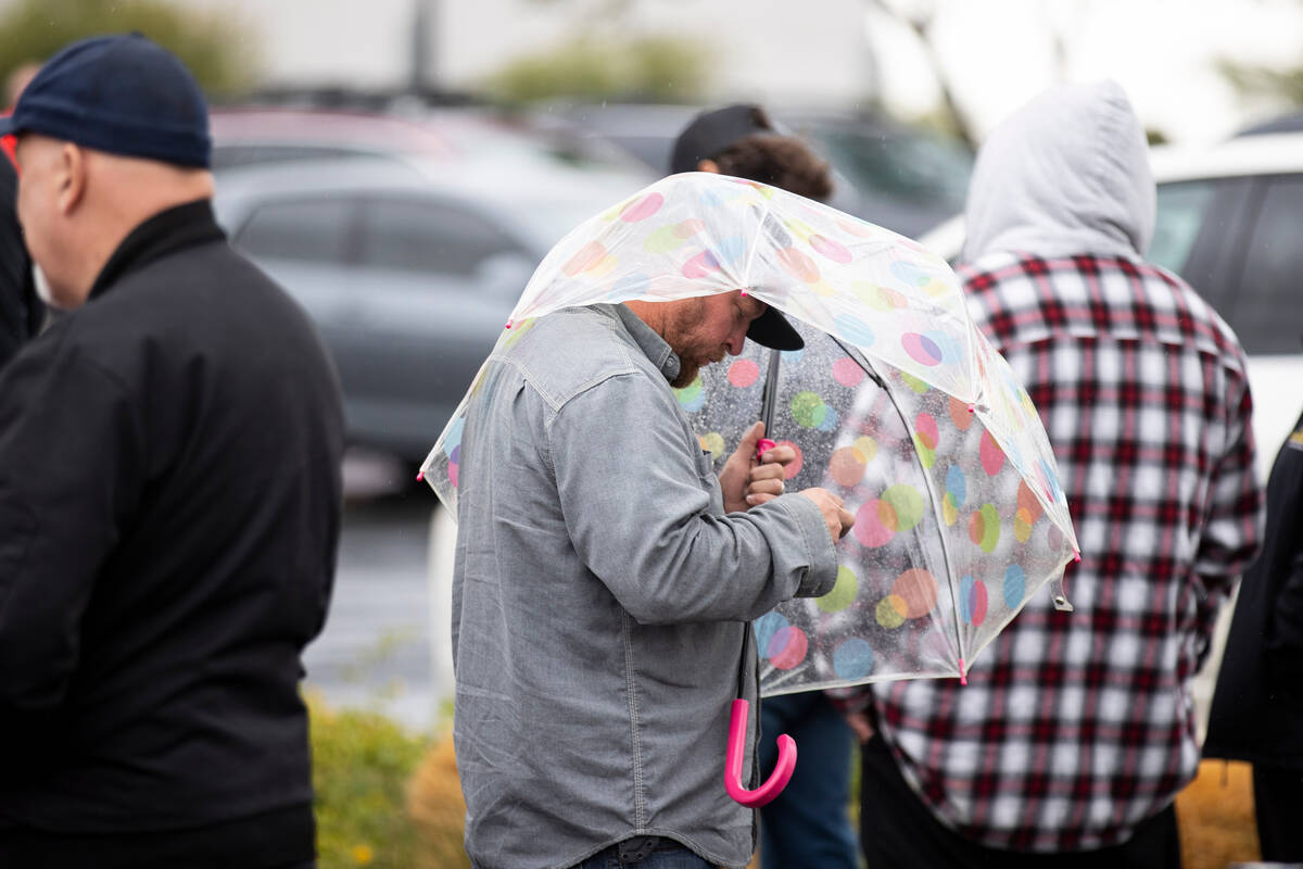 People wait in line to cast their vote at the Centennial Center polling place in Las Vegas, Tue ...