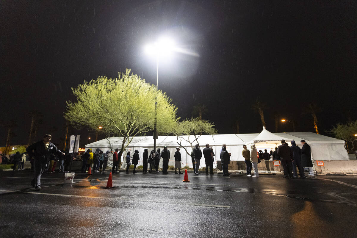 People wait in line to cast their vote at the Centennial Center polling center in Las Vegas, Tu ...