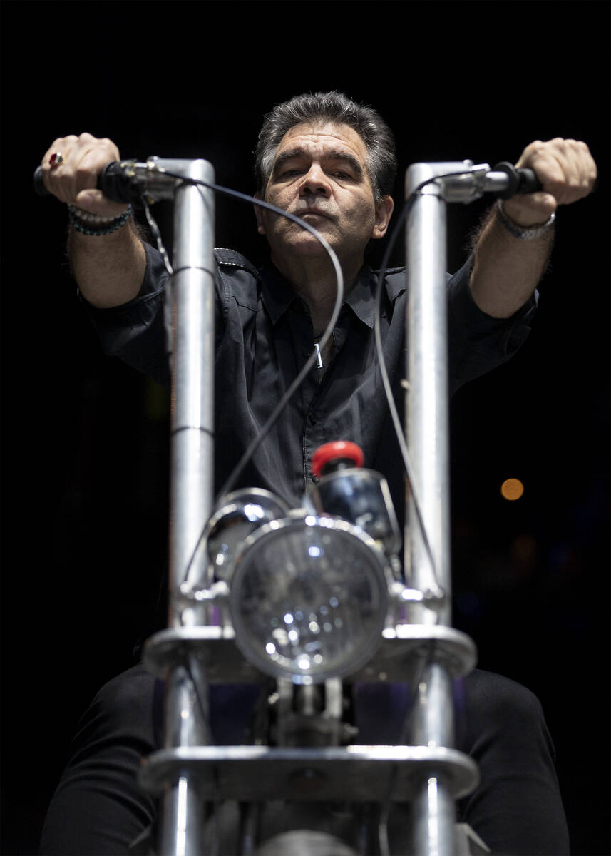 The Review-Journal’s John Katsilomedes rides a motorcycle while rehearsing to be part of ...
