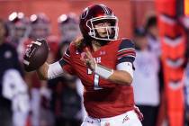 Utah quarterback Cameron Rising throws upfield during the first half of an NCAA college footbal ...