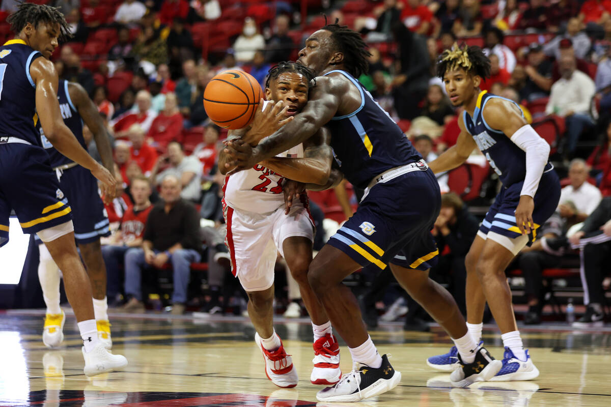 UNLV Rebels guard Jackie Johnson III (24) is fouled by Southern University Jaguars forward Jale ...
