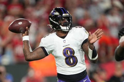 Baltimore Ravens quarterback Lamar Jackson makes a pass attempt during an NFL football game aga ...