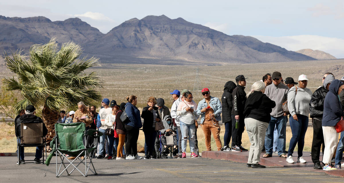 People wait in line to buy lottery tickets at the Lotto Store just across the Nevada/California ...