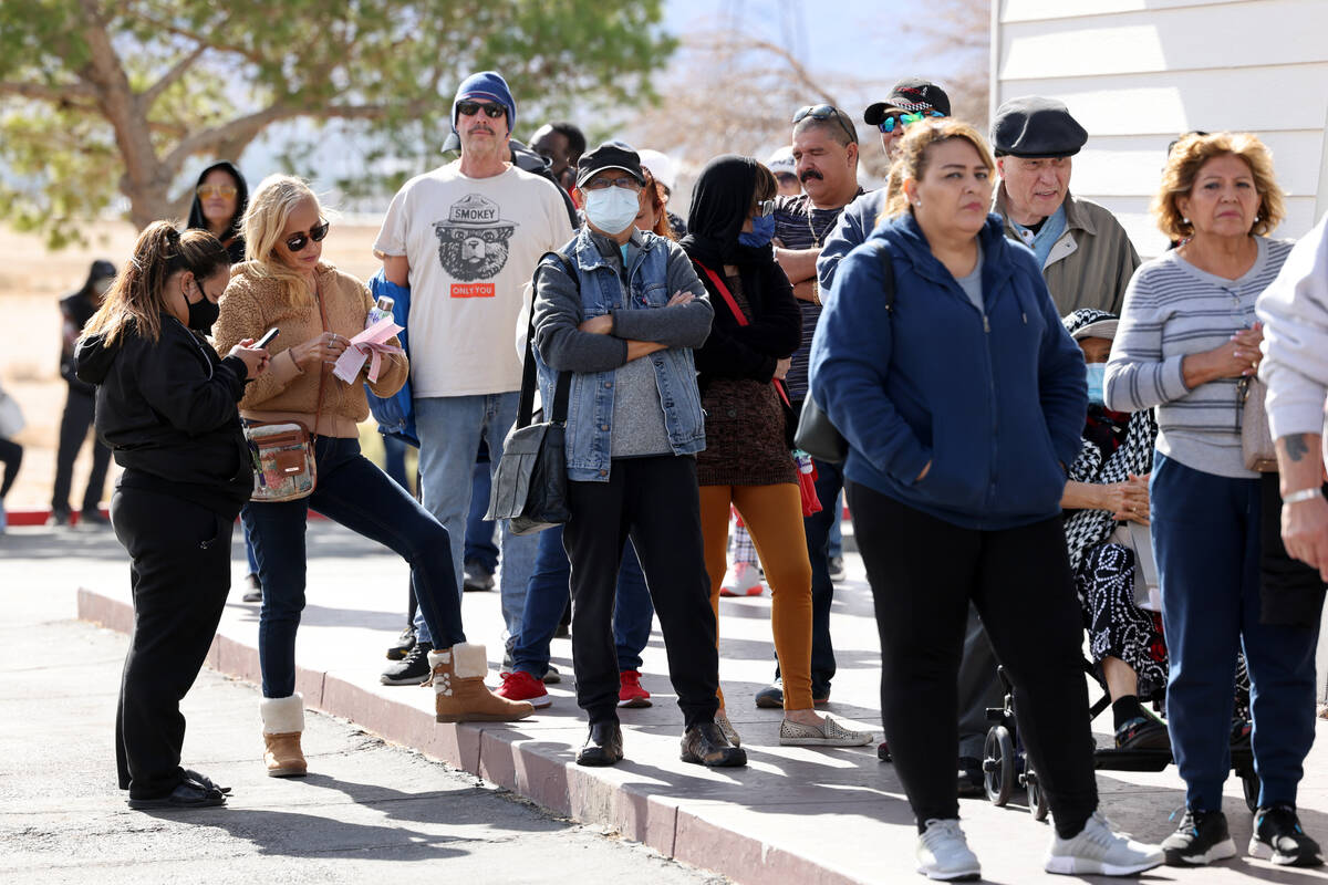 People wait in line to buy lottery tickets at the Lotto Store just across the Nevada/California ...