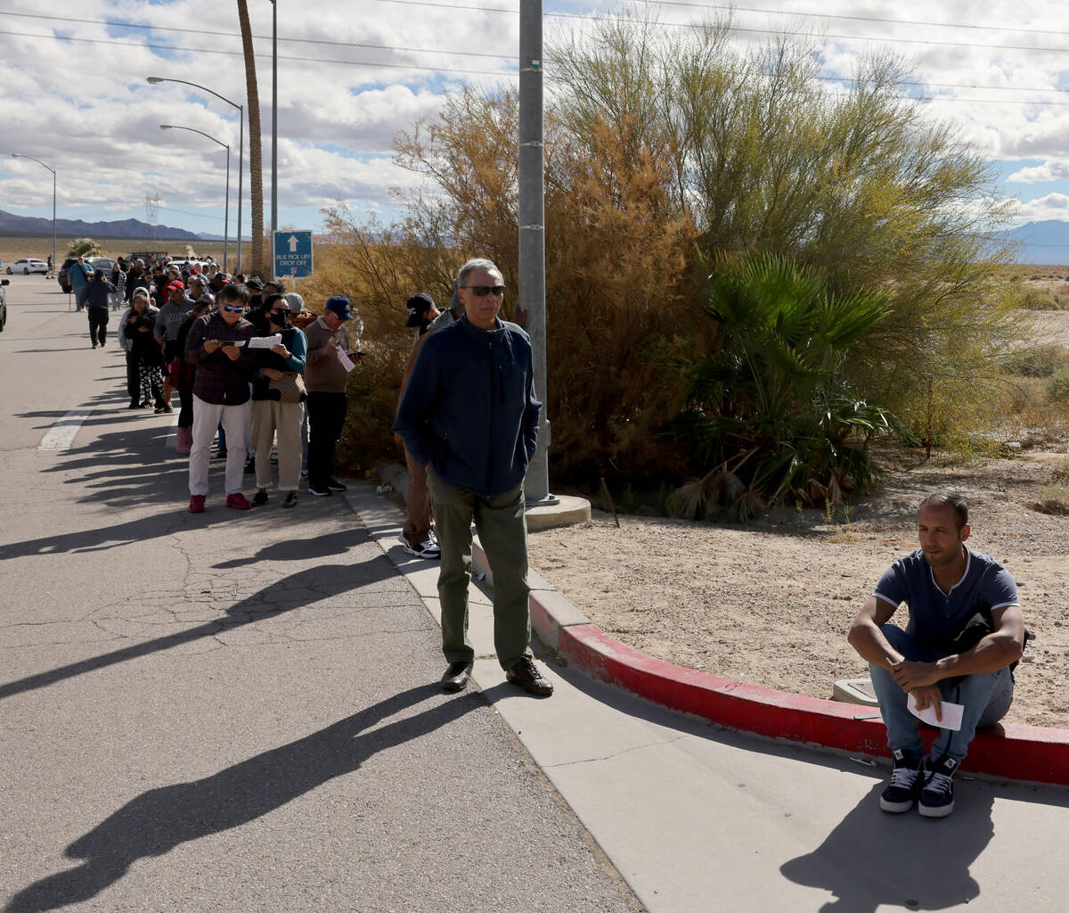People wait in line to buy lottery tickets at the Lotto Store just across the Nevada/California ...