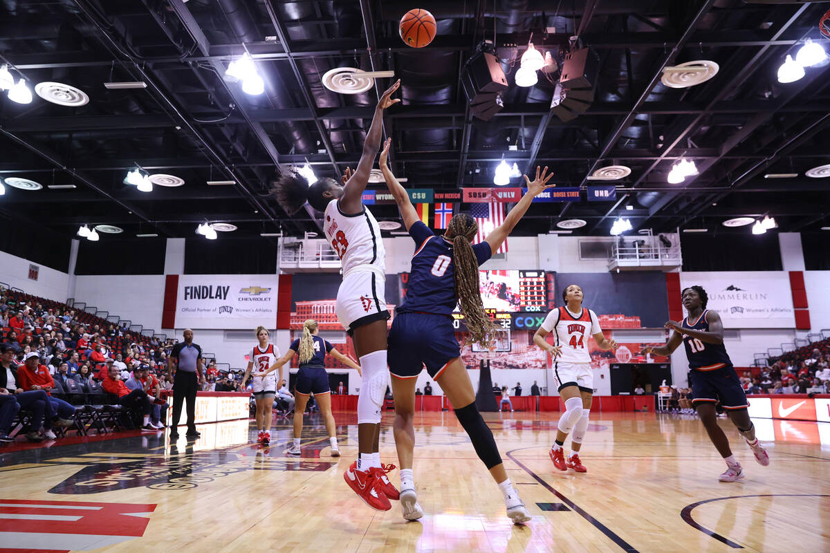 Pepperdine's Theresa Grace Mbanefo (0) defends a shot by UNLV's Desi-Rae Young (23) during the ...
