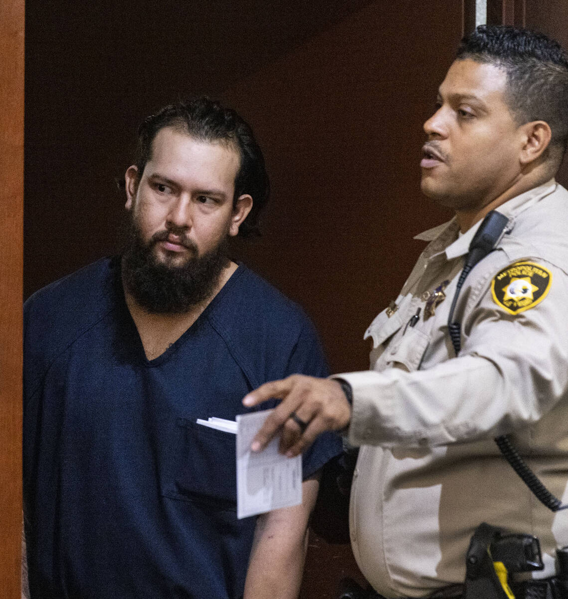 Marco Benitez, who is accused in a deadly DUI crash that also injured eight people, is led into ...