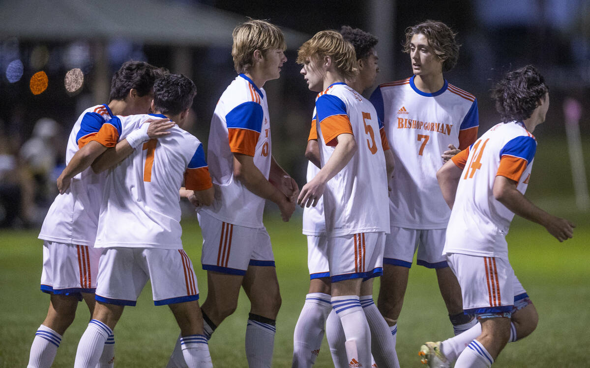 Bishop Gorman's Nicholas Lazarski (1) is congratulated on a goal over Cimarron during the first ...