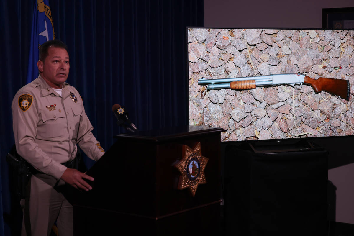 Assistant Sheriff Lazaro Chavez shows a photo of a rifle belonging to Rodney Finch during a new ...
