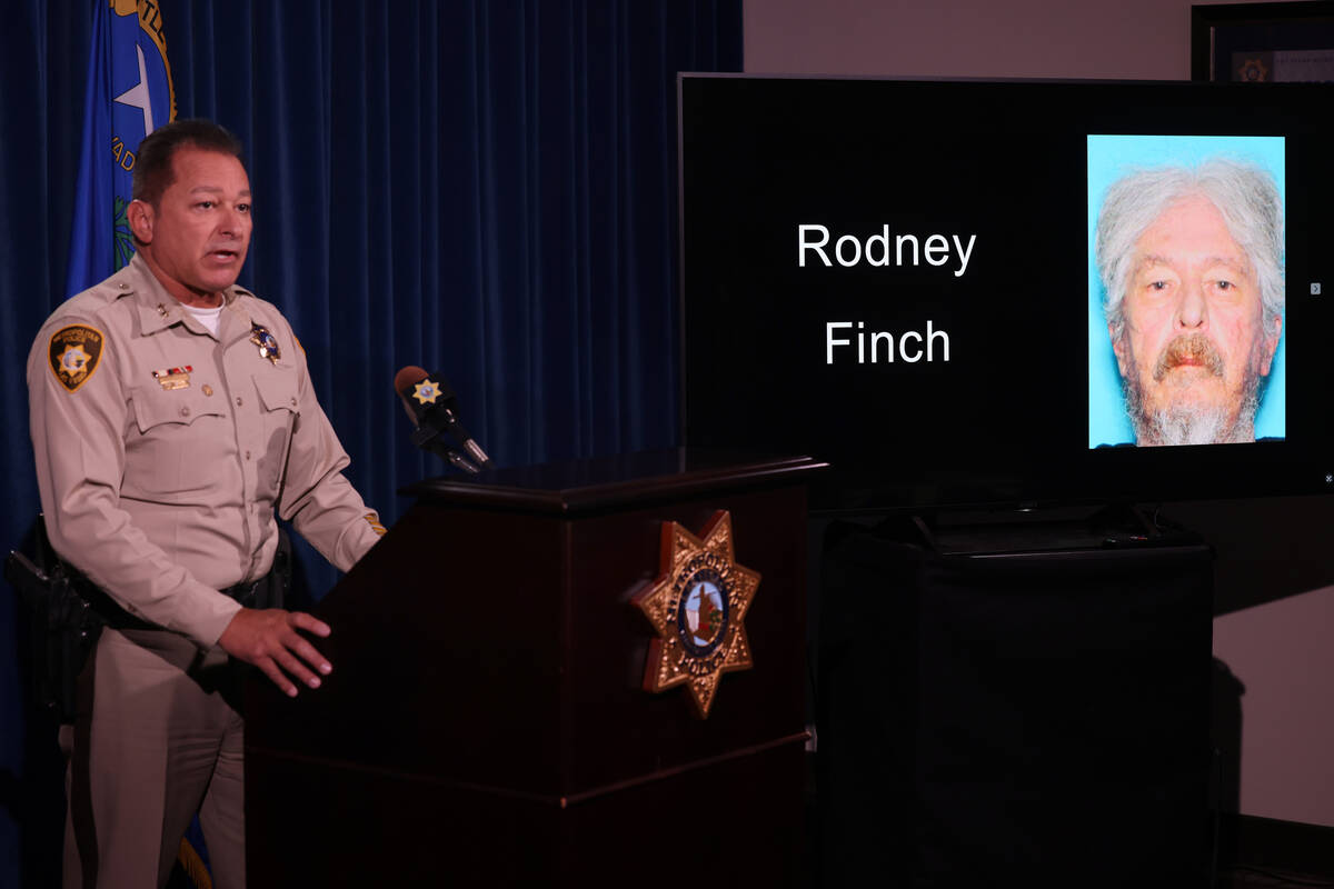 Assistant Sheriff Lazaro Chavez shows a photo of Rodney Finch during a news conference at Metro ...